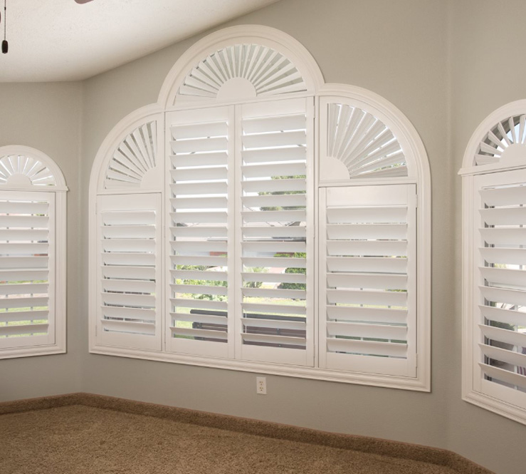 Custom window treatment with white polywood shutters 