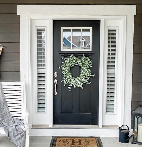 White polywood shutter sidelights on a front porch