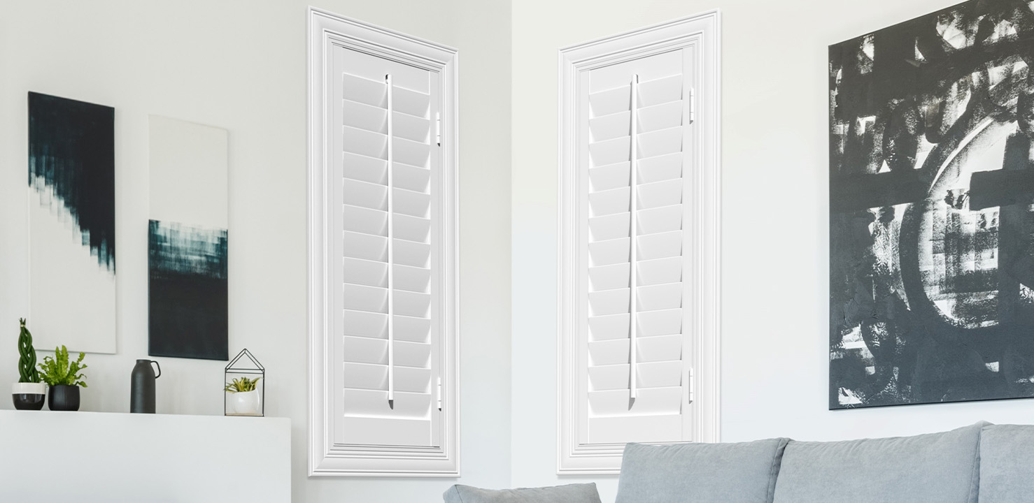 White polywood shutters in a corner of a living room