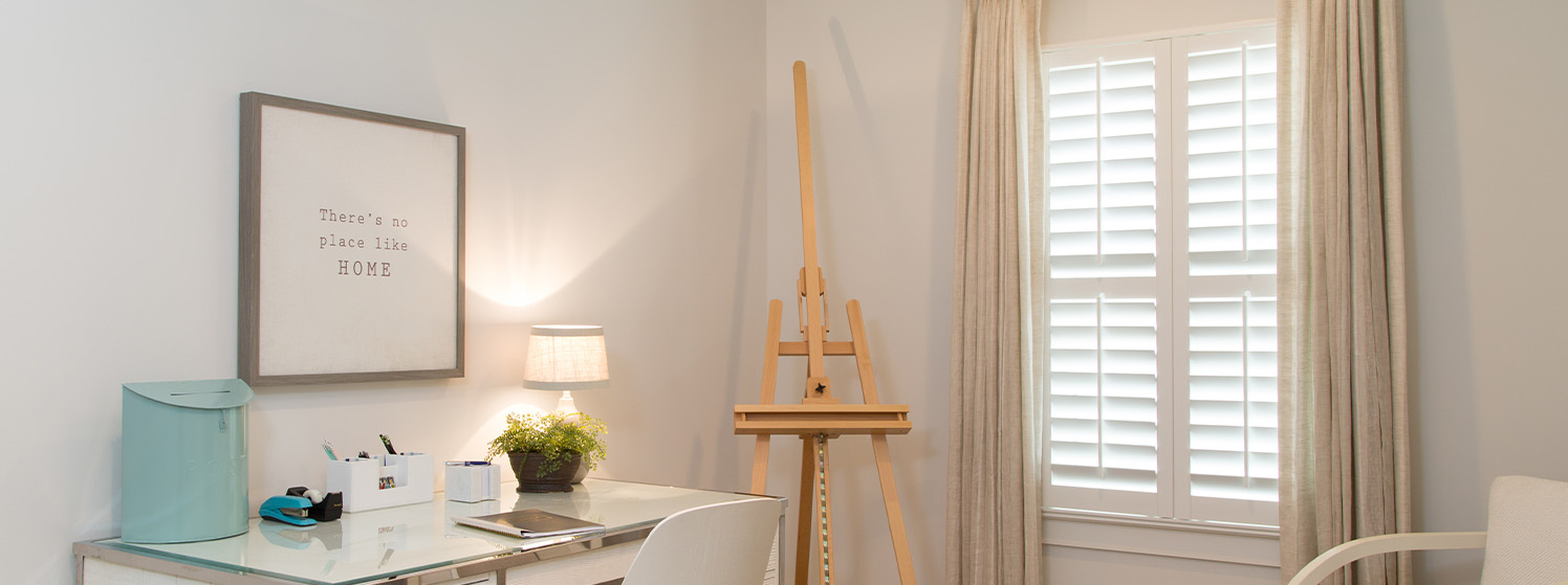 White polywood shutters in an office