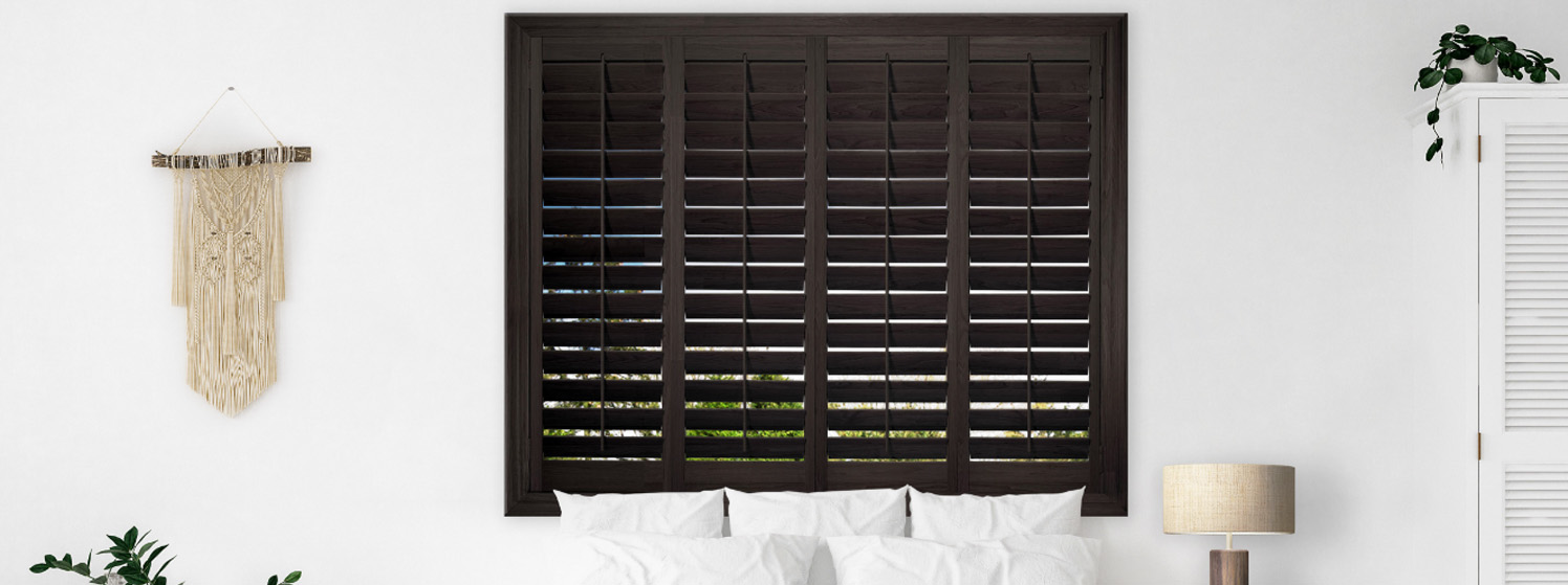 Ovation shutters in a white modern bedroom