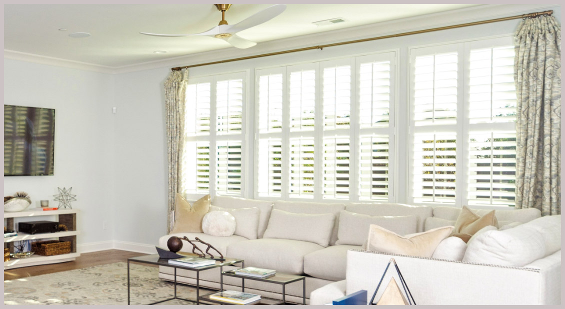 White polywood shutters in a large living room