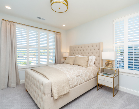 White polywood shutters in a bedroom