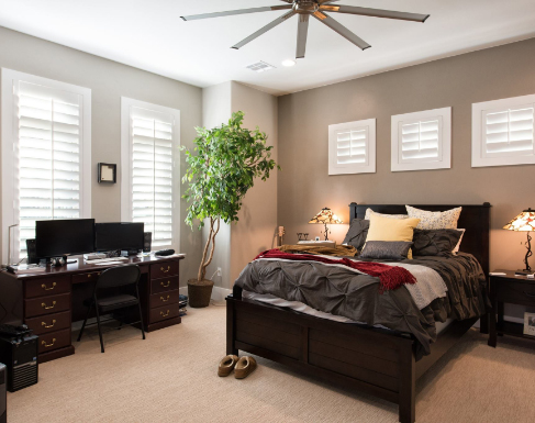White polywood shutters in a bedroom